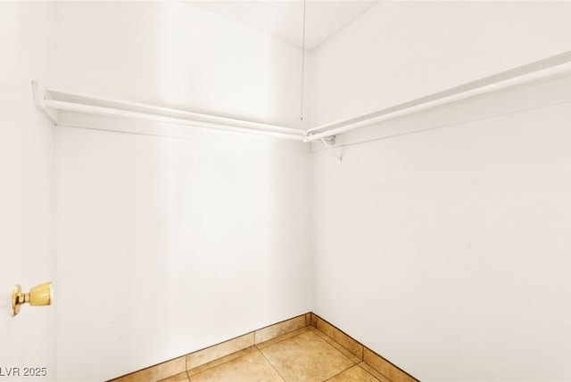 3668 Villa Knolls E Dr, Las Vegas, NV 89120 - walk in closet featuring light tile patterned flooring