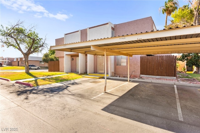 3668 Villa Knolls E Dr, Las Vegas, NV 89120 - view of front facade featuring covered parking and stucco siding