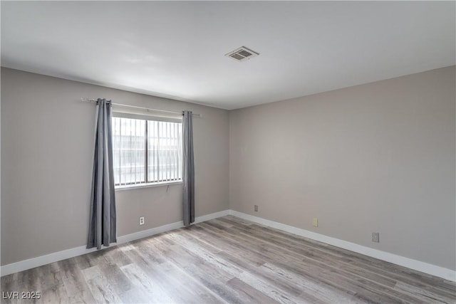 5219 Caliente St Unit 11, Las Vegas, NV 89119 - unfurnished room with wood finished floors and baseboards