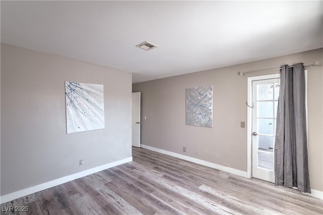 5219 Caliente St Unit 11, Las Vegas, NV 89119 - unfurnished room with wood finished floors and baseboards