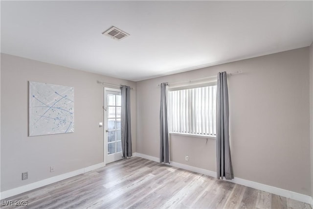 5219 Caliente St Unit 11, Las Vegas, NV 89119 - spare room with wood finished floors and baseboards