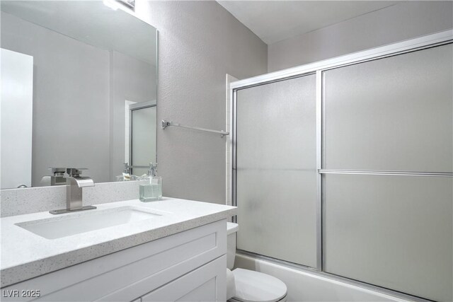 5219 Caliente St Unit 11, Las Vegas, NV 89119 - bathroom with vanity and enclosed tub / shower combo