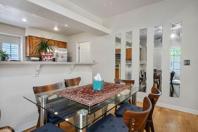 9357 Golden Timber Ln, Las Vegas, NV 89117 - dining room with light wood-style floors and recessed lighting