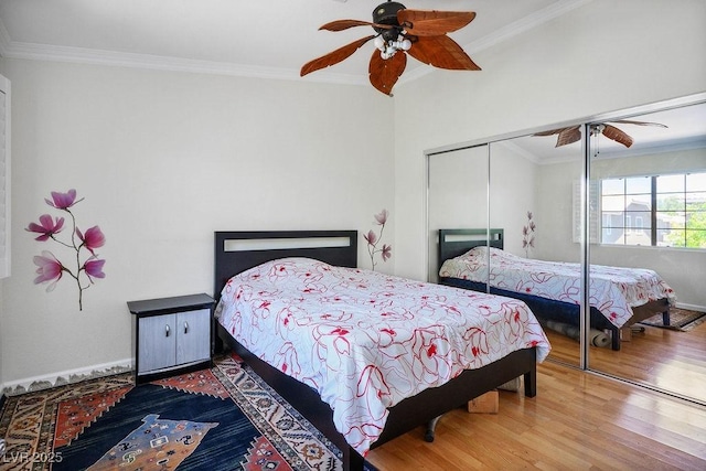 9357 Golden Timber Ln, Las Vegas, NV 89117 - bedroom with crown molding, wood finished floors, a closet, and a ceiling fan