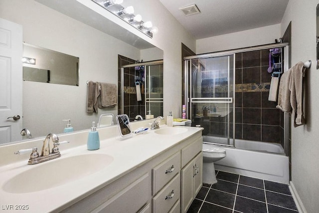 9357 Golden Timber Ln, Las Vegas, NV 89117 - bathroom with tile patterned floors, double vanity, and combined bath / shower with glass door