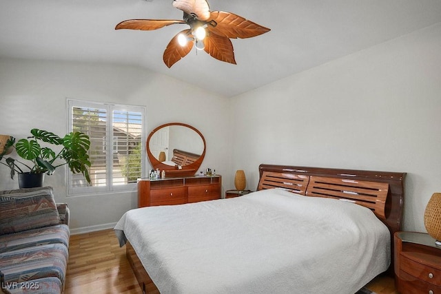 9357 Golden Timber Ln, Las Vegas, NV 89117 - bedroom with vaulted ceiling, light wood-type flooring, and a ceiling fan