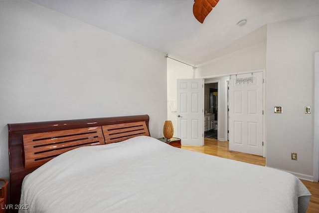 9357 Golden Timber Ln, Las Vegas, NV 89117 - bedroom with lofted ceiling, wood finished floors, and a ceiling fan