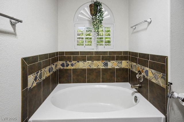 9357 Golden Timber Ln, Las Vegas, NV 89117 - bathroom featuring a garden tub and a textured wall