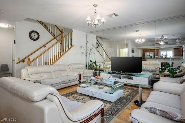 9357 Golden Timber Ln, Las Vegas, NV 89117 - living area with a chandelier, stairs, and wood finished floors