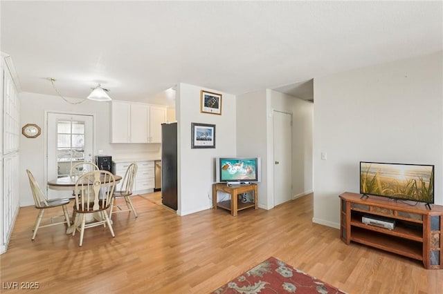 4027 Maple Hill Rd, Las Vegas, NV 89115 - dining area featuring light wood finished floors and baseboards