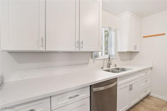 4027 Maple Hill Rd, Las Vegas, NV 89115 - kitchen featuring dishwasher, white cabinetry, and light stone countertops