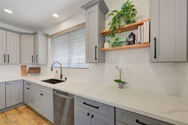 189 Andada Dr, Henderson, NV 89012 - kitchen with gray cabinetry, stainless steel dishwasher, open shelves, backsplash, and recessed lighting