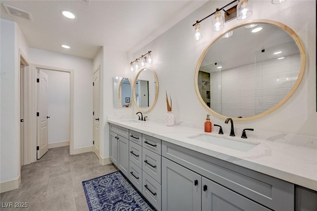 189 Andada Dr, Henderson, NV 89012 - full bathroom with double vanity, recessed lighting, and tiled shower