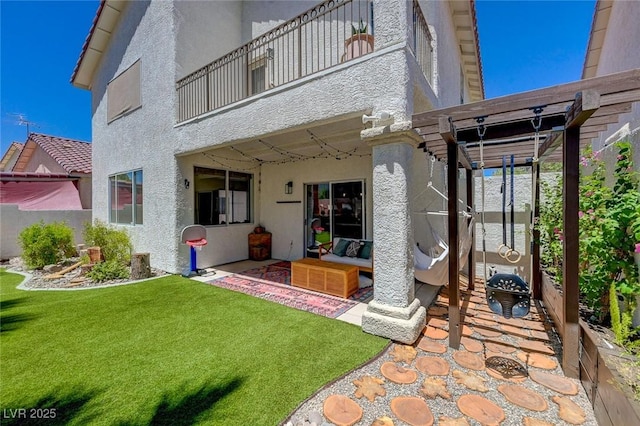 189 Andada Dr, Henderson, NV 89012 - back of property with stucco siding, a balcony, a patio area, an outdoor living space, and a pergola