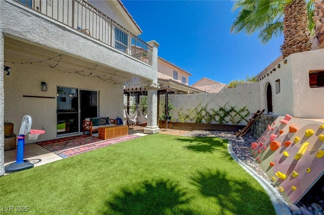 189 Andada Dr, Henderson, NV 89012 - view of yard with a balcony, an outdoor living space, and a patio