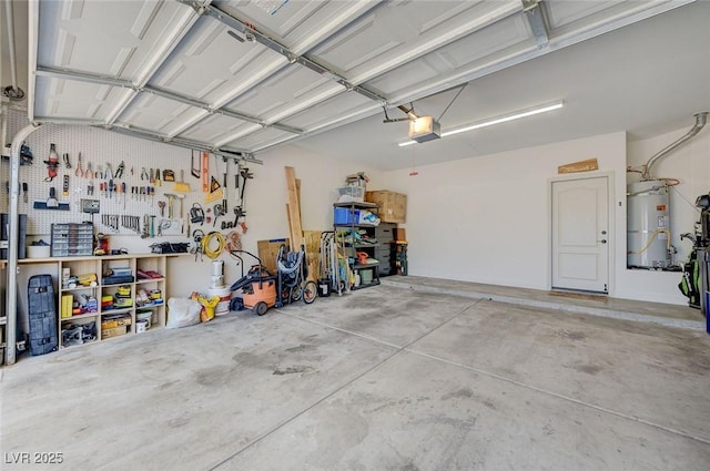 189 Andada Dr, Henderson, NV 89012 - garage with strapped water heater, a garage door opener, and a workshop area
