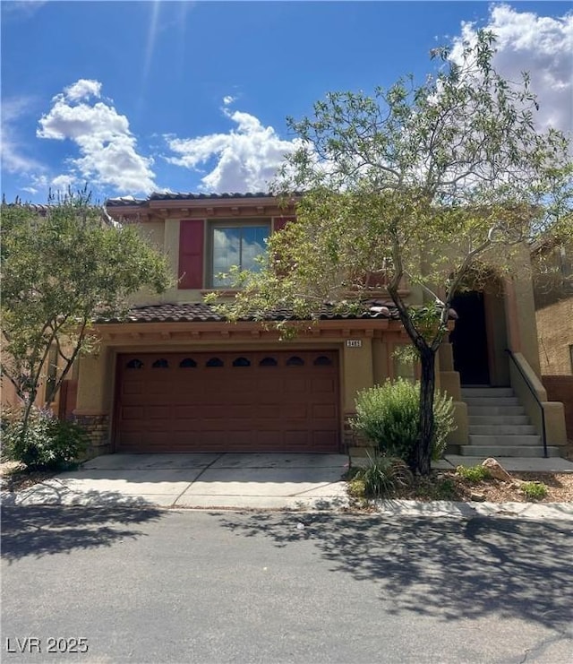 9485 Whitewater Crest Ct, Las Vegas, NV 89178 - view of front facade with concrete driveway, stucco siding, an attached garage, and a tiled roof