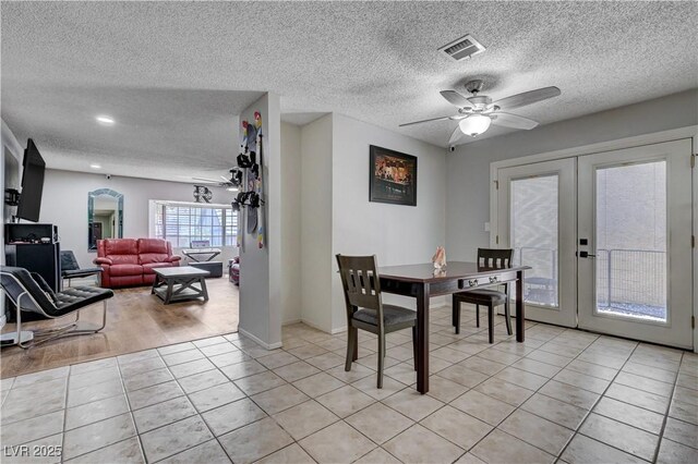 3928 Edgemoor Way, Las Vegas, NV 89121 - dining area with french doors, a textured ceiling, light tile patterned flooring, and ceiling fan