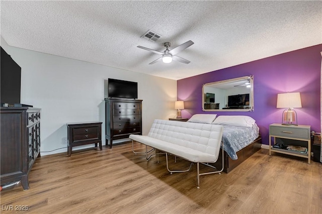 3928 Edgemoor Way, Las Vegas, NV 89121 - bedroom with wood finished floors, a textured ceiling, and ceiling fan