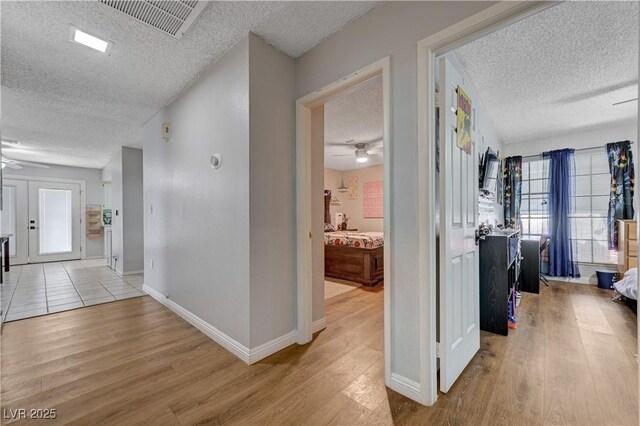 3928 Edgemoor Way, Las Vegas, NV 89121 - corridor featuring a textured ceiling and light wood-style flooring