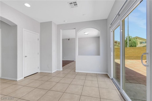 6678 Crystal Run Ln, Las Vegas, NV 89122 - spare room with arched walkways and light tile patterned flooring