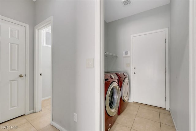 6678 Crystal Run Ln, Las Vegas, NV 89122 - laundry area with washing machine and clothes dryer and light tile patterned flooring
