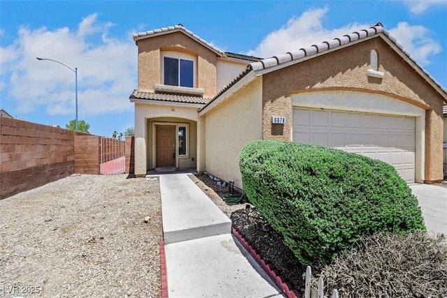 6678 Crystal Run Ln, Las Vegas, NV 89122 - mediterranean / spanish home with stucco siding, an attached garage, a gate, a tiled roof, and driveway