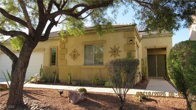 1504 Andrew David Ave, North Las Vegas, NV 89086 - view of front of home with a garage and stucco siding