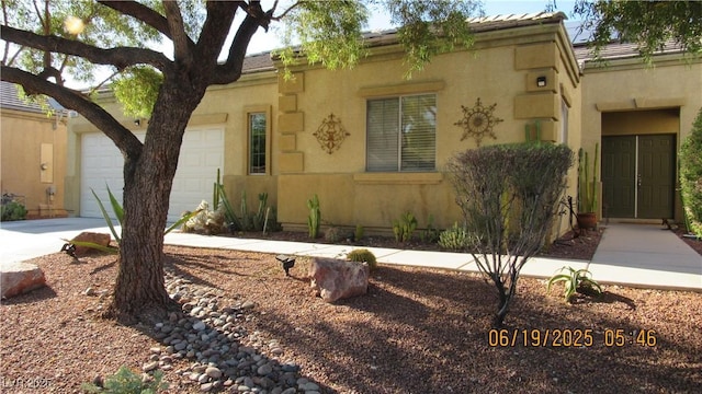 1504 Andrew David Ave, North Las Vegas, NV 89086 - view of front facade with concrete driveway, a garage, and stucco siding