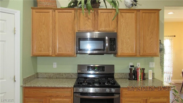 1504 Andrew David Ave, North Las Vegas, NV 89086 - kitchen featuring stainless steel appliances, light stone counters, and recessed lighting