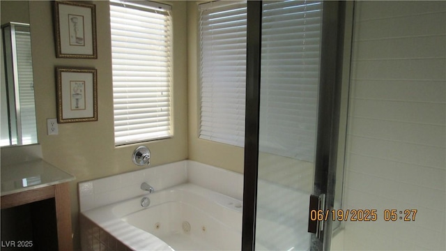 1504 Andrew David Ave, North Las Vegas, NV 89086 - full bathroom featuring vanity, a whirlpool tub, and a stall shower