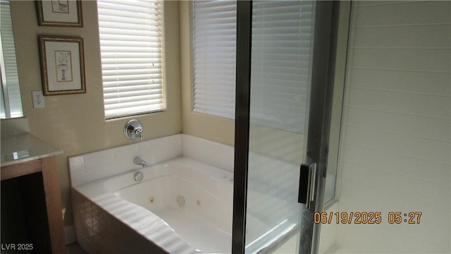 1504 Andrew David Ave, North Las Vegas, NV 89086 - bathroom featuring plenty of natural light, vanity, and a jetted tub