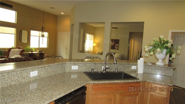 1504 Andrew David Ave, North Las Vegas, NV 89086 - kitchen featuring dishwasher and light stone counters