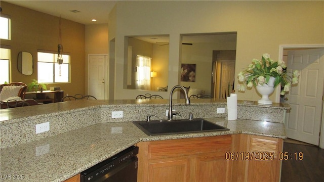 1504 Andrew David Ave, North Las Vegas, NV 89086 - kitchen featuring black dishwasher, light stone counters, recessed lighting, and hanging light fixtures