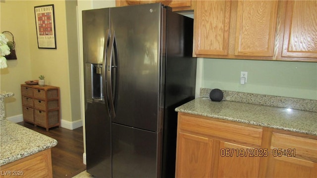 1504 Andrew David Ave, North Las Vegas, NV 89086 - kitchen with refrigerator with ice dispenser, light stone countertops, and dark wood-style flooring