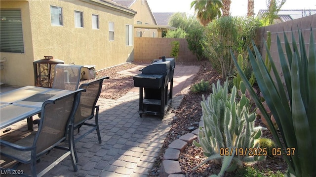 1504 Andrew David Ave, North Las Vegas, NV 89086 - fenced backyard with a patio and outdoor dining space