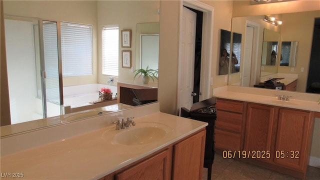 1504 Andrew David Ave, North Las Vegas, NV 89086 - bathroom featuring vanity, a garden tub, and tile patterned flooring