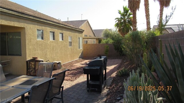 1504 Andrew David Ave, North Las Vegas, NV 89086 - fenced backyard with a patio and outdoor dining space