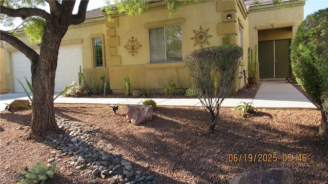 1504 Andrew David Ave, North Las Vegas, NV 89086 - entrance to property with an attached garage and stucco siding