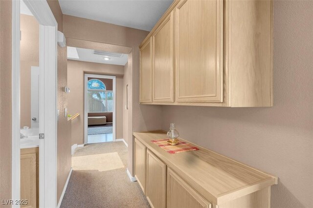 9909 Masked Duck Ave, Las Vegas, NV 89117 - corridor with baseboards and carpet floors