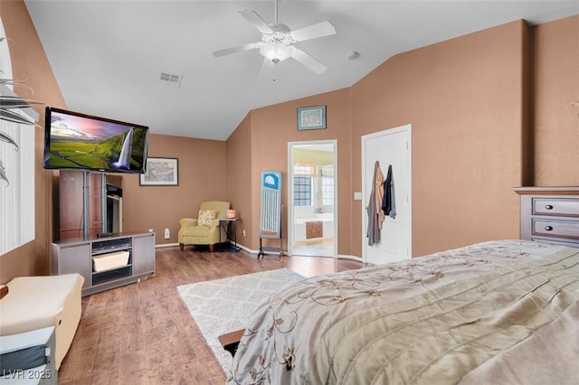 9909 Masked Duck Ave, Las Vegas, NV 89117 - bedroom featuring vaulted ceiling, wood finished floors, connected bathroom, and ceiling fan