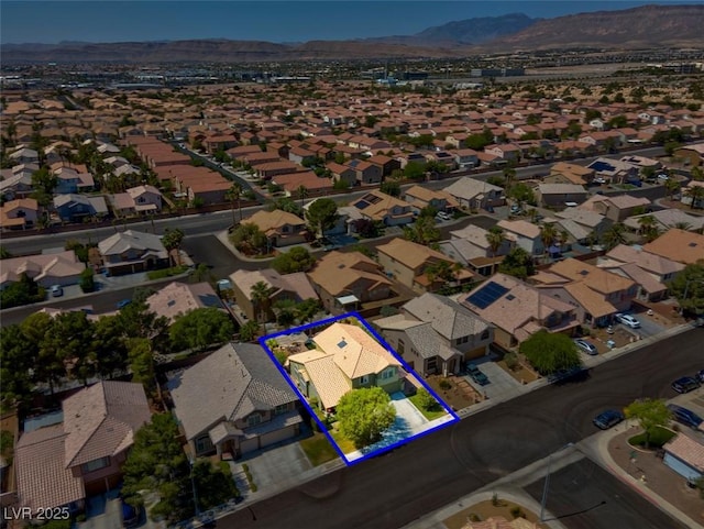 9909 Masked Duck Ave, Las Vegas, NV 89117 - aerial perspective of suburban area featuring mountains and property parcel outlined
