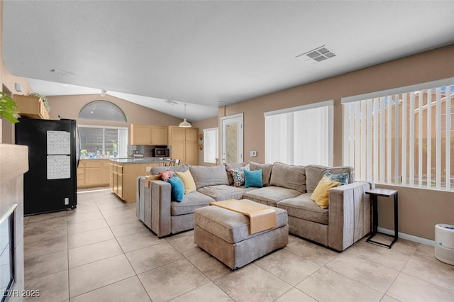 9909 Masked Duck Ave, Las Vegas, NV 89117 - living room with light tile patterned floors and lofted ceiling