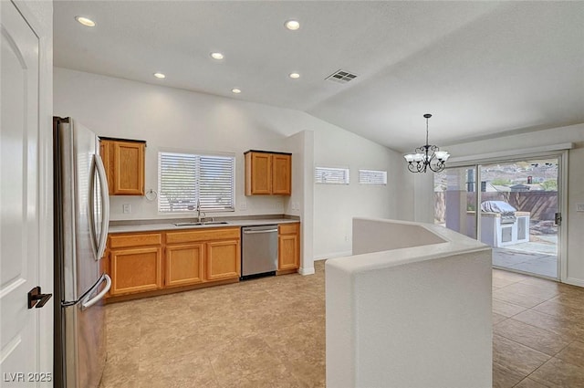 2059 Joy View Ln, Henderson, NV 89012 - kitchen with appliances with stainless steel finishes, vaulted ceiling, plenty of natural light, recessed lighting, and hanging light fixtures
