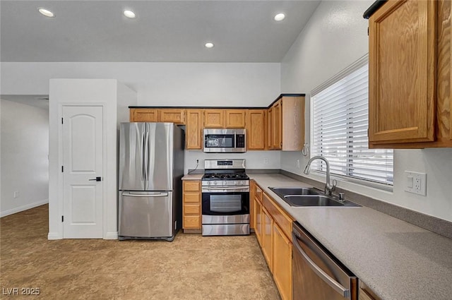 2059 Joy View Ln, Henderson, NV 89012 - kitchen featuring stainless steel appliances, brown cabinetry, recessed lighting, and light countertops