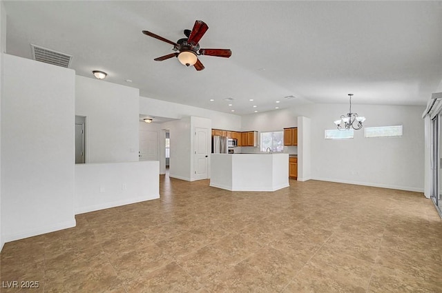 2059 Joy View Ln, Henderson, NV 89012 - unfurnished living room featuring a chandelier, a ceiling fan, and lofted ceiling