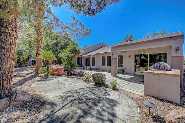 2059 Joy View Ln, Henderson, NV 89012 - rear view of property with a ceiling fan, a patio area, and stucco siding