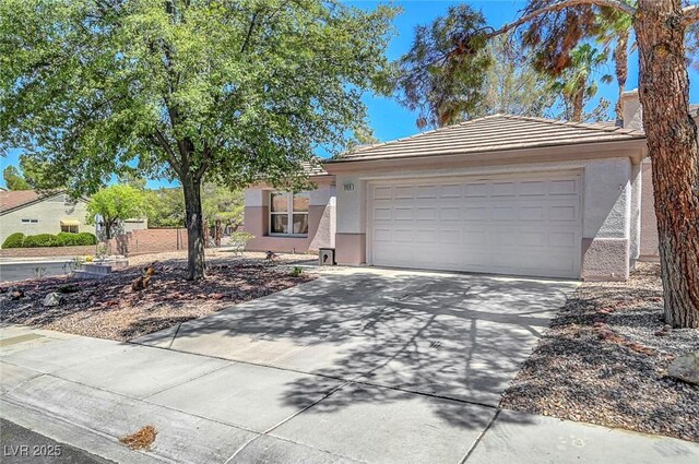 2059 Joy View Ln, Henderson, NV 89012 - view of front of property with stucco siding, driveway, an attached garage, and a tile roof