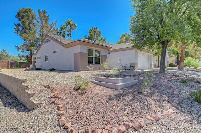 2059 Joy View Ln, Henderson, NV 89012 - view of home's exterior with stucco siding and an attached garage