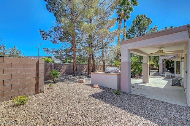 2059 Joy View Ln, Henderson, NV 89012 - fenced backyard featuring a ceiling fan, a patio, and area for grilling